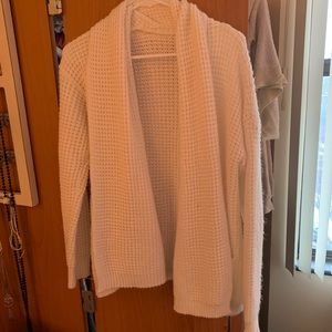 Tick, white cardigan with pockets on the side!